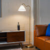 Majestic Brass Ring Base Curved Floor Lamp with Triangle White Drum Shade